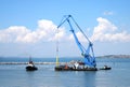 Floating crane and marine tug Royalty Free Stock Photo