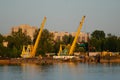 Floating crane in the river port on a summer day. The concept of export and import of goods Royalty Free Stock Photo