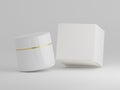 Shiny cream jar floating with packaging box on a plain white background