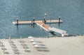 Floating dock, floating platform. Approach to the aluminum floating dock. Royalty Free Stock Photo