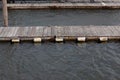 Floating docks with bumpers, weathered wood and water copy space