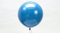 Floating Dreams: Vibrant Blue Balloon Isolated on White Background for Cutout Design and Conceptual Imagery