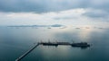 Floating drilling platform on the ocean at evening in rainy season aerial view