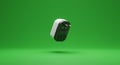 A floating electrical plug adapter against a solid green background. The adapter Royalty Free Stock Photo