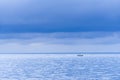 Floating fishing boats aground at the harbor over cloudy sky at Royalty Free Stock Photo