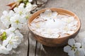 Floating flowers ( Cherry blossom) and burning candle.