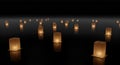 Floating Golden Lanterns on Dark Water at Night Royalty Free Stock Photo