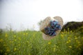 Floating hat in flower field Royalty Free Stock Photo