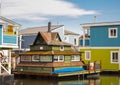 Floating Home Village Colorful Houseboats. Fisherman`s Wharf Reflection Inner Harbor, Victoria BC Royalty Free Stock Photo