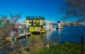 Floating Home Village colorful Houseboats Water Taxi Fisherman`s Wharf Reflection Inner Harbor, Victoria British Columbia Canada Royalty Free Stock Photo