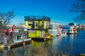 Floating Home Village colorful Houseboats Water Taxi Fisherman`s Wharf Reflection Inner Harbor, Victoria British Columbia Canada Royalty Free Stock Photo