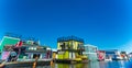 Floating Home Village colorful Houseboats Water Taxi Fisherman`s Wharf Reflection Inner Harbor, Victoria British Columbia Canada Royalty Free Stock Photo