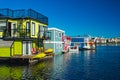 Floating Home Village colorful Houseboats Water Taxi Fisherman`s Wharf Reflection Inner Harbor, Victoria British Columbia Canada Royalty Free Stock Photo