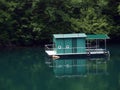 Floating house on lake. Royalty Free Stock Photo