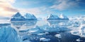 Floating ice and glacier at sunset in Antarctica, view of icebergs in sea and frozen shores. Antarctic landscape with sun and snow