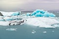 Floating icebergs and view to the glacier, ice lagoon Jokulsarlon, Iceland Royalty Free Stock Photo