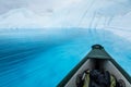 Floating in an inflatable canoe on a supraglacial lake on the Matanuska Glacier in Alaska