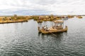 Floating Islands on Lake Titicaca Puno, Peru, South America, thatched home. Dense root that plants Khili