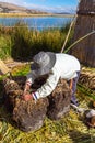 Floating Islands on Lake Titicaca Puno, Peru, South America, thatched home. Dense root that plants Khili Royalty Free Stock Photo