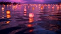 Floating lanterns above a lake with purple sunset sky Royalty Free Stock Photo