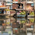 Floating market with reflection in water. Royalty Free Stock Photo