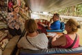 Floating market shopkeeper haggling with boat passengers Royalty Free Stock Photo