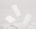 Floating melamine white sponges. Cleaning concept and household product. Melamine