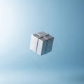Floating metallic cube in blue space Royalty Free Stock Photo