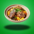 Floating Morroccan Kofte Couscous on green Royalty Free Stock Photo