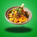 Floating Morroccan lamb Couscous on green gradient Royalty Free Stock Photo