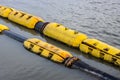 Floating old dredging pipes on the river close up Royalty Free Stock Photo