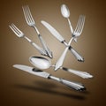 Floating Old Silverware Set with shadows on brown gradient Royalty Free Stock Photo