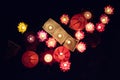 Floating paper lanterns on the water at night