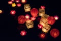 Floating paper lanterns on the water at night