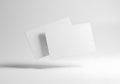 Floating paper sheets in minimalist setting isolated on white background Royalty Free Stock Photo