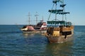 Floating pirate ships near the embankment of Berdyansk