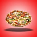 Floating Pizza tuna on red radial gradient Royalty Free Stock Photo