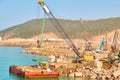 Floating platform and lifting machinery on the construction site in the sea harbor Royalty Free Stock Photo