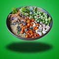 Floating Poke in bowl on green gradient Royalty Free Stock Photo