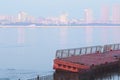 Floating pontoon pier on the embankment of the city of Blagoveshchensk. Flooding on the Amur. Increased water level. In the haze,