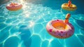Floating Pool Toys with Light Reflections Overhead in Sunlit Water Royalty Free Stock Photo