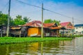 Floating poor wooden house at the riverside on the Chao Phraya river. Thailand, Bangkok Royalty Free Stock Photo
