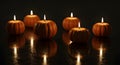 Floating pumpkin candle arrangement, unexpected and elegant Halloween decoration. Royalty Free Stock Photo