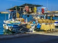A floating quayside market in Chania harbour, Crete on a bright sunny day Royalty Free Stock Photo