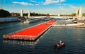 The floating race track installed on Seine river near Alexandre III bridge in Paris, France .