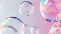 Floating rainbow soap bubbles on a colored background, copy space. Banner, poster. Royalty Free Stock Photo