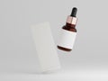 Floating amber dropper bottle and packaging box on a plain white background