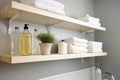 floating shelves storing laundry detergents and softeners Royalty Free Stock Photo