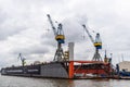 Floating shipyard with heavy cranes in the port of Hamburg