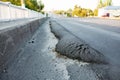 Floating substandard asphalt. Poor quality road Royalty Free Stock Photo